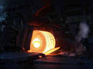 FILE PHOTO: A steel coil is unrolled on the line at the Novolipetsk Steel PAO steel mill in Farrell, Pennsylvania