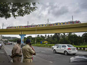 Navi Mumbai: A Metro train passes by during its trial run on 11.10 km-long Navi ...
