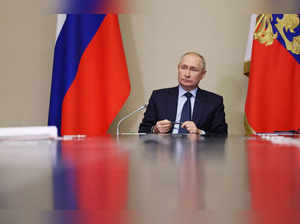 Russian President Vladimir Putin chairs a meeting on operational issues, outside Moscow
