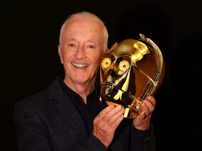 Actor Anthony Daniels, who played C-3PO in 11 Star Wars films, holds a screen-matched, light-up C-3PO head from the 1977 film 'Star Wars: A New Hope'