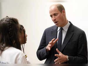 Britain's Prince William, Prince of Wales speaks to young people as he participates in a series of workshops which focus on emotions, relationships and community action, during a visit to Factory Works in Birmingham, central England on October 10, 2023, as they begin a series of visits to mark World Mental Health Day.