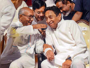 Bhopal: Madhya Pradesh Congress President Kamal Nath with party leader Digvijaya...
