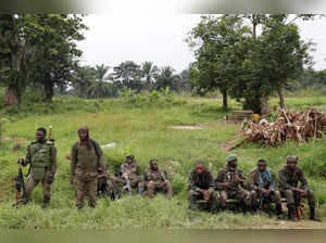 FILE PHOTO: Armed Forces of the Democratic Republic of the Congo (FARDC) soldiers rest next to a road after Islamist rebel group called the Allied Democratic Forces (ADF) attacked area around Mukoko village