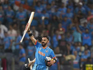 Pune: India's Virat Kohli celebrates after scoring the winning runs as well as h...