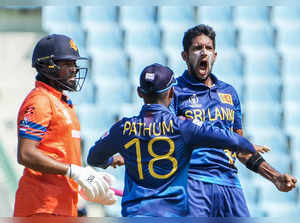 Lucknow: Sri Lanka's bowler Kasun Rajitha celebrates the wicket of Netherlands' ...