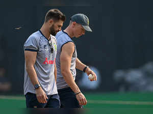 South Africa's Aiden Markram (L) and Rassie van der Dussen inspect the pitch during a practice session on the eve of their 2023 ICC Men's Cricket World Cup one-day international (ODI) match against Bangladesh at the Wankhade Stadium in Mumbai on October 23, 2023.