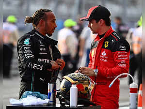 Mercedes' British driver Lewis Hamilton (L) speaks with Ferrari's Monegasque driver Charles Leclerc after the Sprint race at the Circuit of the Americas in Austin, Texas, on October 21, 2023 ahead of the United States Formula One Grand Prix.