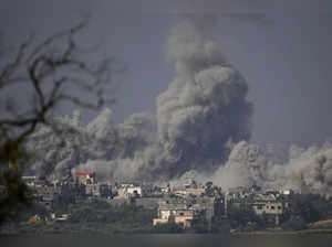 Smoke rises following an Israeli airstrike in the Gaza Strip, as seen from south...