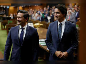 Canada's Prime Minister Justin Trudeau and Conservative Party of Canada leader Pierre Poilievre stand in the House of Commons on Parliament Hill in Ottawa