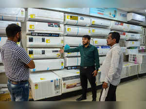 Gurugram: People purchase air conditioners (AC) at a showroom on a hot summer da...