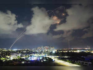 Israeli Iron Dome air defense system fires to intercept a rocket fired from the ...