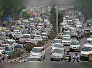 FILE PHOTO: Heavy traffic moves along a busy road during a power-cut at the traffic light junctions in New Delhi