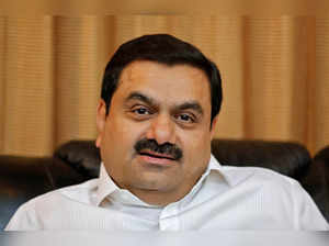 FILE PHOTO: Indian billionaire Adani speaks during an interview with Reuters at his office in Ahmedabad