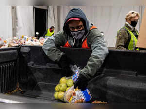 FILE PHOTO: People receive donations at a food bank in Ohio