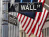 Wall St falls as megacaps slide, investors assess earnings and data