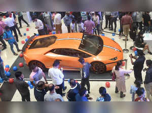 Kolkata: People watch a car during the 2nd edition 'Accelerate Auto Expo' at a s...