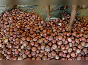 New Delhi, Oct 28 (ANI): Labourers arrange onions at Ghazipur vegetable market a...