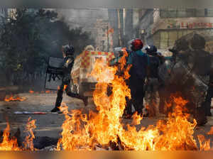Police try to disperse protesters during clash with the supporters of Bangladesh Nationalist Party (BNP) in Dhaka