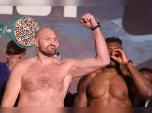 Britain's Tyson Fury (L) and Cameroonian-French Francis Ngannou react during their weigh-in on the eve of their bout in Riyadh on October 27, 2023.
