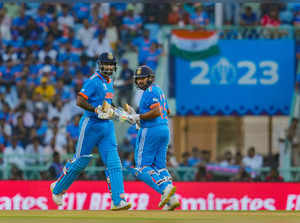 Lucknow: India's batters Rohit Sharma and Suryakumar Yadav run between the wicke...