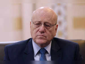 Lebanon's caretaker prime minister Najib Mikati listens to a question during an interview with AFP at his office in Beirut on October 30, 2023.
