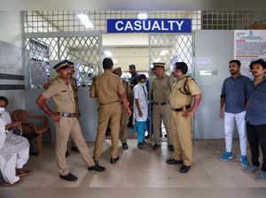 Policemen stand guard at the entrance of the casualty ward of a hospital where injured devotees were admitted after multiple blasts occurred during a religious gathering of Jehovah's Witnesses, in Kochi
