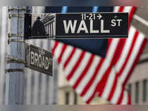 Wall St closes higher on eve of Fed decision; investors assess earnings