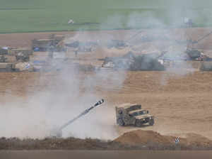 Israeli artillery unit fires from the Israeli side of the Israel-Gaza border into Gaza