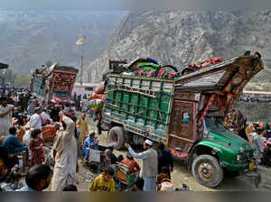 Afghan refugees with their belongings arrive on trucks from Pakistan at the Afghanistan-Pakistan Torkham border in Nangarhar province on November 1, 2023.
