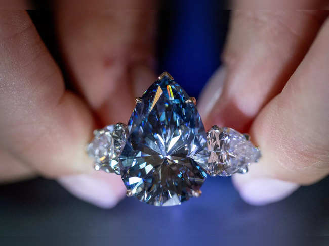 Chiadini holds the "Bleu Royal" diamond during an auction preview at Christie’s in Geneva