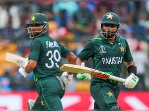 Bengaluru: Pakistan's captain Babar Azam and Fakhar Zaman run between the wicket...