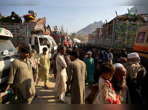 Afghan nationals return from Pakistan at the Torkham border crossing between Pakistan and Afghanistan