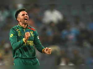 South Africa's Keshav Maharaj celebrates after taking the wicket of New Zealand's James Neesham during the 2023 ICC Men's Cricket World Cup one-day international (ODI) match between New Zealand and South Africa at the Maharashtra Cricket Association Stadium in Pune on November 1, 2023.