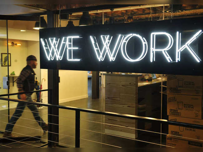 A man enter the doors of the "WeWork" co-operative co-working space on March 13, 2013 in Washington, DC.