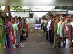 Chhattisgarh, Nov 7 (ANI): Voters wait in queues to cast their votes for the fir...