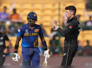 Bengaluru: New Zealand's Mitchell Santner celebrates the wicket of Sri Lanka's A...