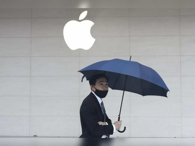 FILE PHOTO: Man walks past an Apple store in Taipei