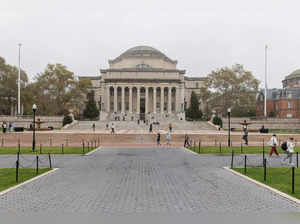 People walk past Columbia University in New York