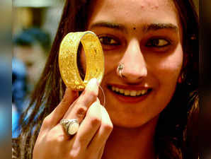 Nagpur, Nov 10 (ANI): A woman shops for Gold jewellery at a showroom on the occa...