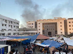 FILE PHOTO: Smoke rises as displaced Palestinians take shelter at Al Shifa hospital, amid the ongoing conflict between Hamas and Israel, in Gaza City