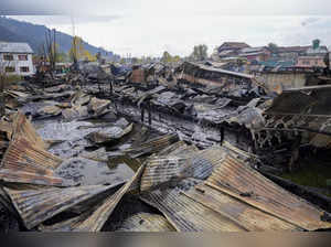 Srinagar: Remains of houseboats after a fire in the tourist hub of Dal Lake, in ...