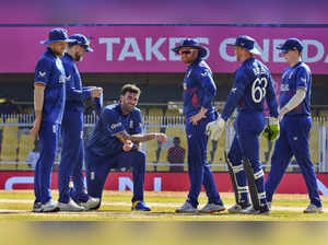 Guwahati: England's cricketers celebrate the wicket of Bangladesh's batter Najmu...