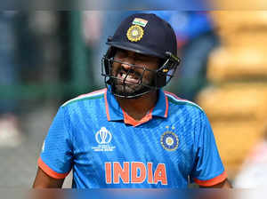 India's captain Rohit Sharma reacts after he was hit by the ball during the 2023 ICC Men's Cricket World Cup one-day international (ODI) match between India and Netherlands at the M. Chinnaswamy Stadium in Bengaluru on November 12, 2023.