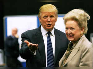 FILE PHOTO: Donald Trump gestures as he stands next to his sister Maryanne Trump Barry, during a break in proceedings of the Aberdeenshire Council inquiry into his plans for a golf resort, Aberdeen