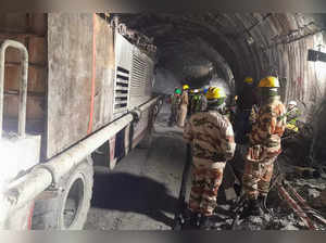 Rescue workers gather at the site after a tunnel collapsed in the Uttarkashi district of India's Uttarakhand state on November 13, 2023.