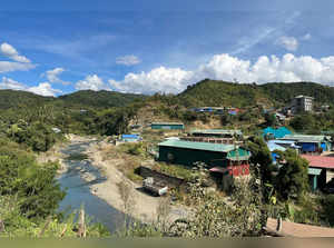 A view of Myanmar's Khawmawi village on the India-Myanmar border across the Tiau river as seen from Zokhawthar village
