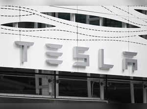 Signage is displayed outside the Tesla Inc Santa Monica Place store, in Santa Monica, California on March 20, 2023.