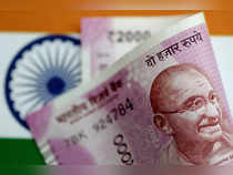 Rupee climbs, forward premiums rise on Fed pivot bets