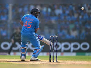 India's captain Rohit Sharma plays a shot during the 2023 ICC Men's Cricket World Cup one-day international (ODI) first semi-final match between India and New Zealand at the Wankhede Stadium in Mumbai on November 15, 2023.