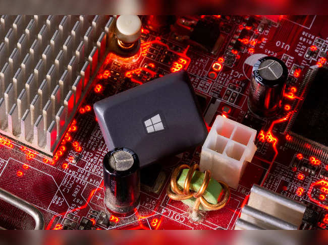 FILE PHOTO: A computer keyboard button with the Microsoft Windows 10 logo is seen on a motherboard in this picture illustration